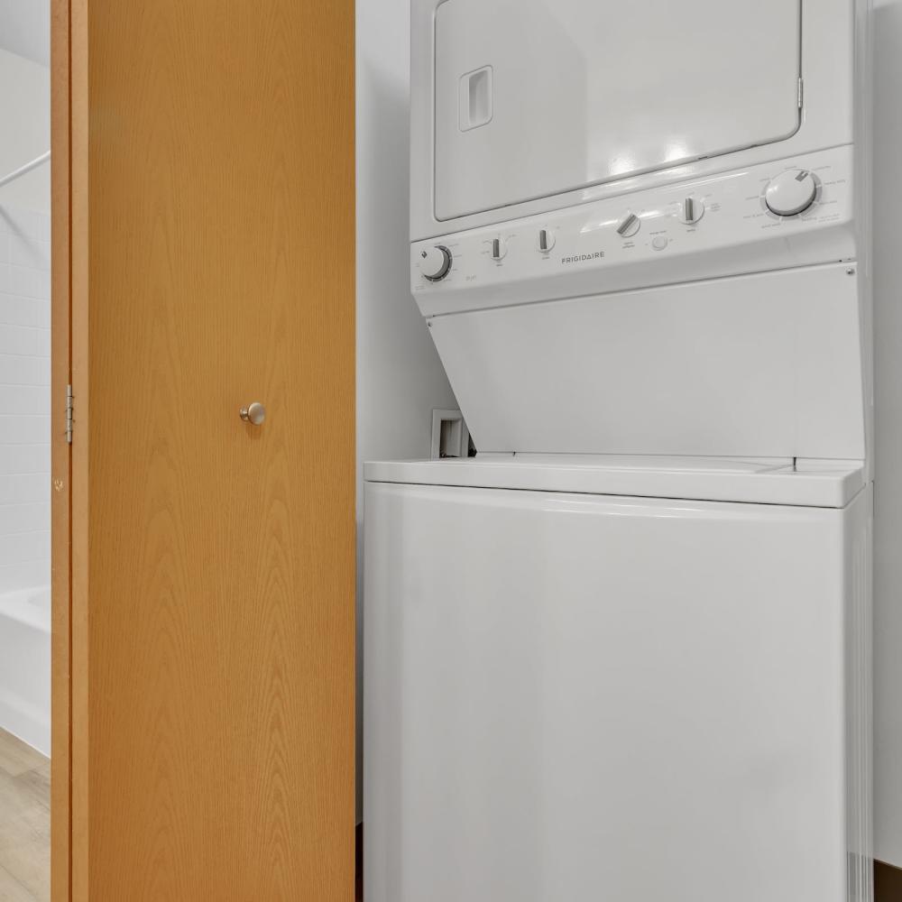 Laundry room with stackable washer and dryer at Residences on Main in Twin Lakes, Wisconsin