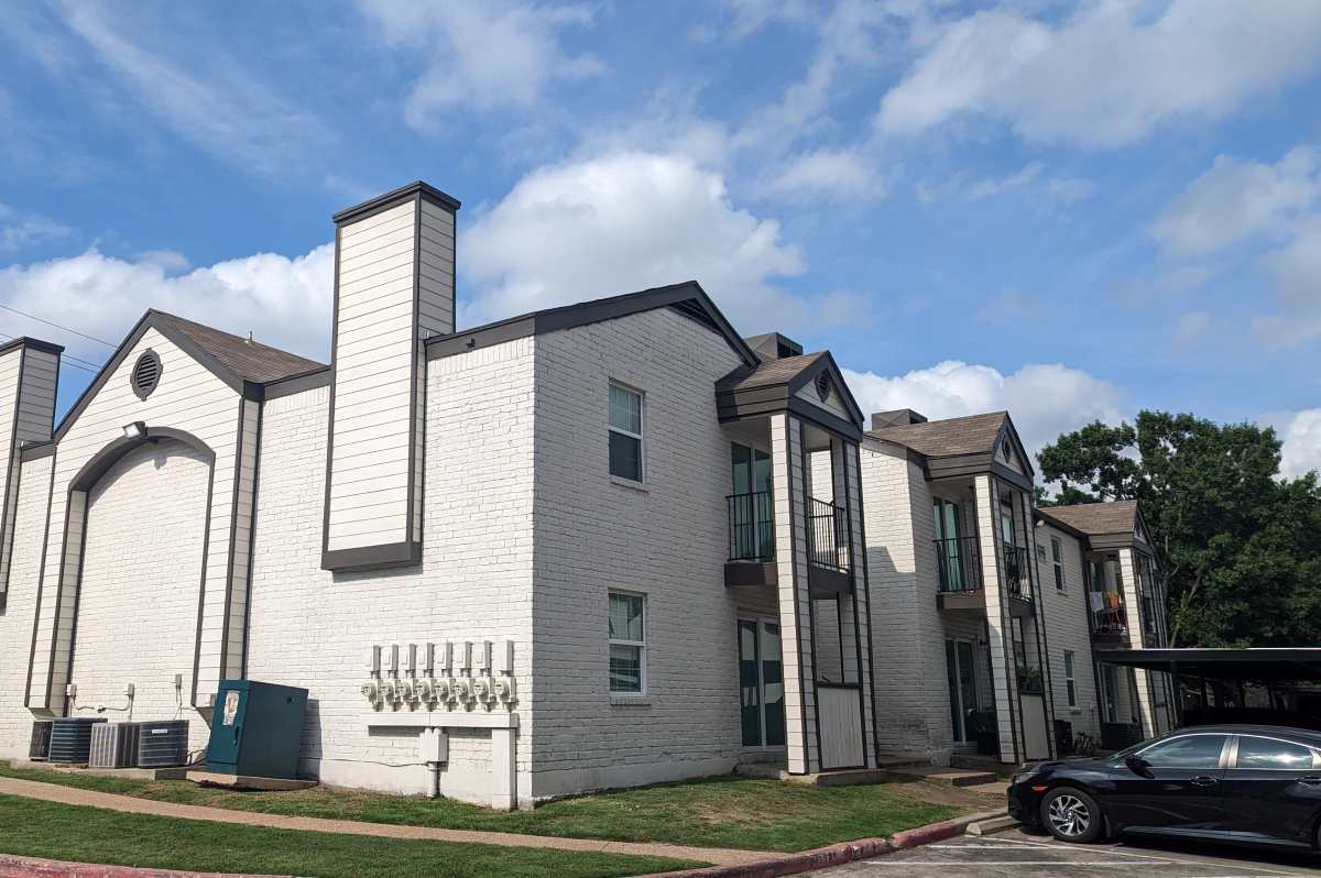 Charming two-story apartment with modern architecture and inviting balconies at Sangria Park in Austin, Texas.