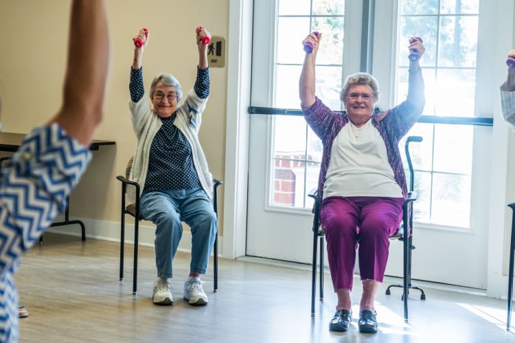 Residents enjoy some chair exercises at Harmony at West Ashley in Charleston, South Carolina