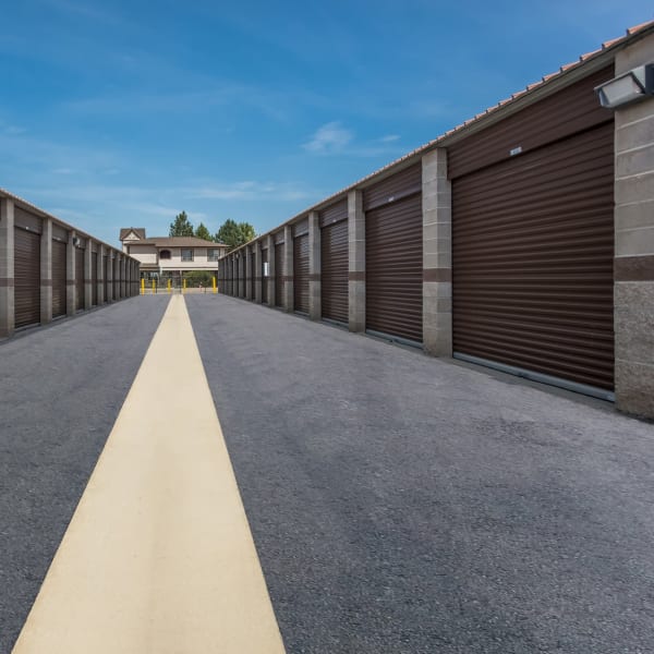 Outdoor storage units with bright doors at StorQuest Self Storage in Aurora, Colorado