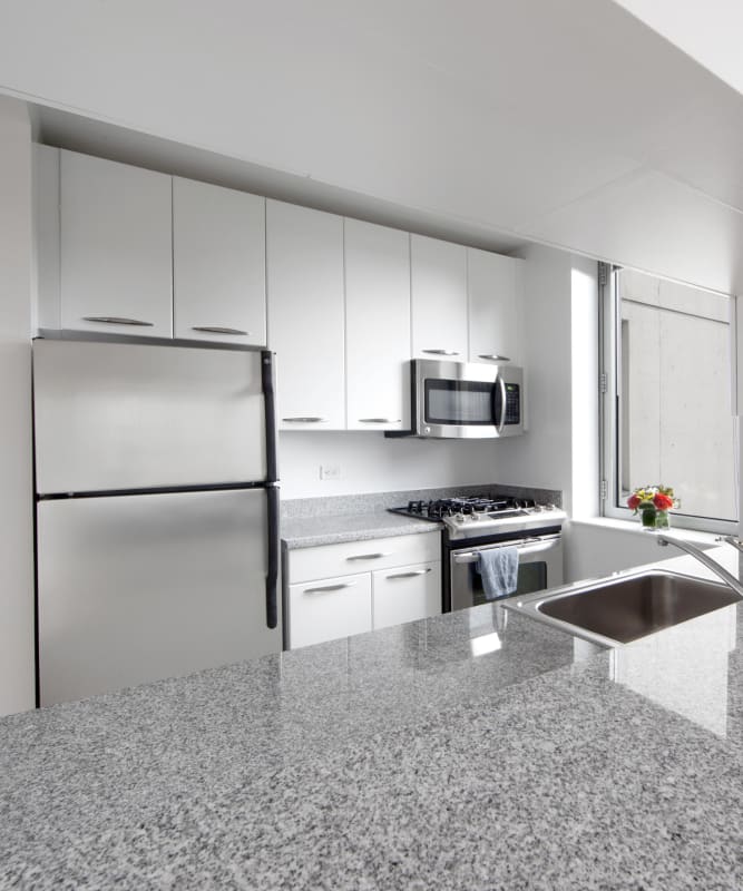 A kitchen with granite counter tops at The Metropolis in New York, New York