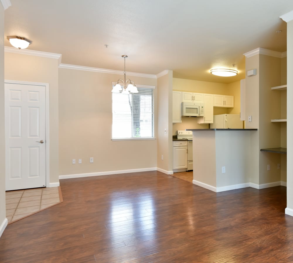 Living room with wood flooring and built-in shelves at Emerald Park Apartment Homes in Dublin, California