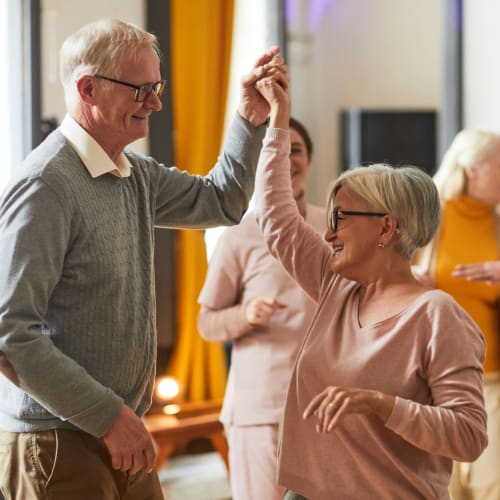 Residents dancing together in a class at Oxford Vista Wichita in Wichita, Kansas