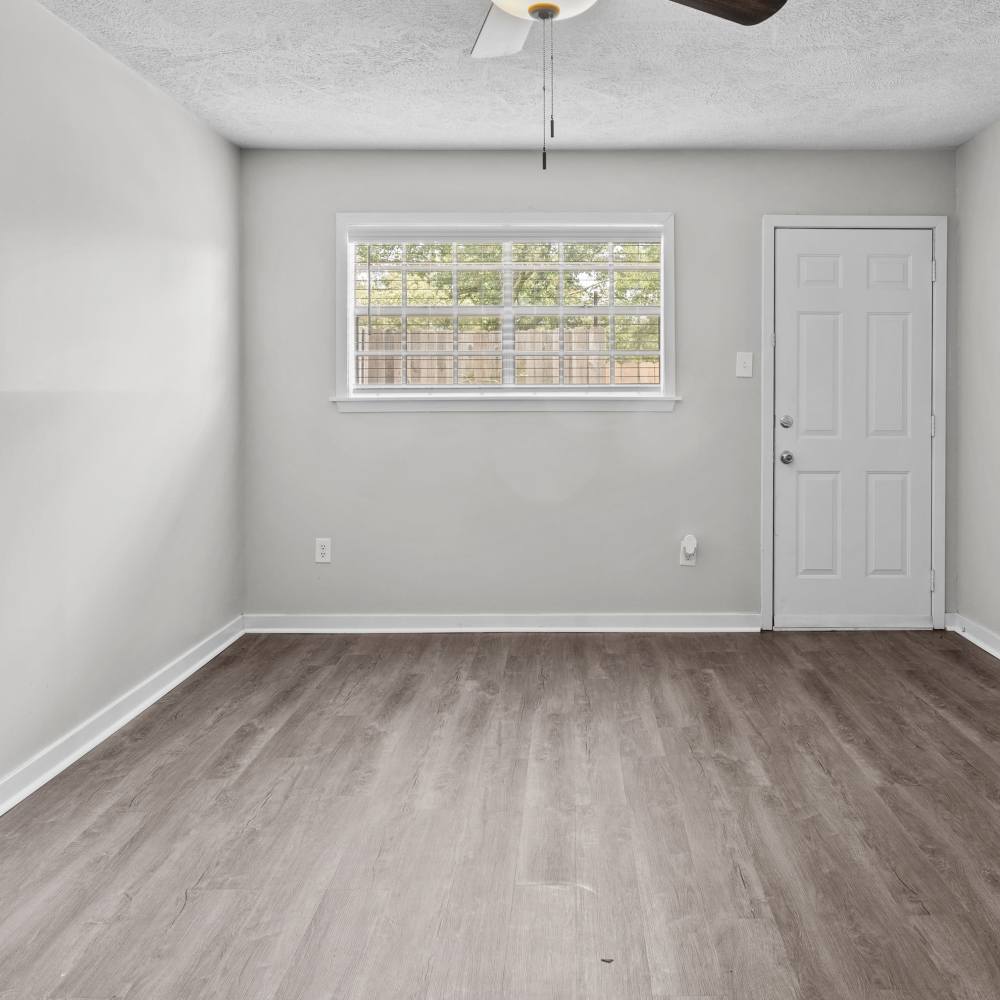 Charming bedroom with modern finishes and abundant natural light at Pecan Ridge in Vicksburg, Mississippi.