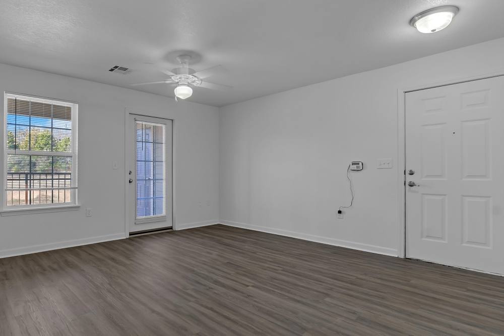 Spacious living room with natural light and modern finishes at Wickham Gardens in Sapulpa, Oklahoma