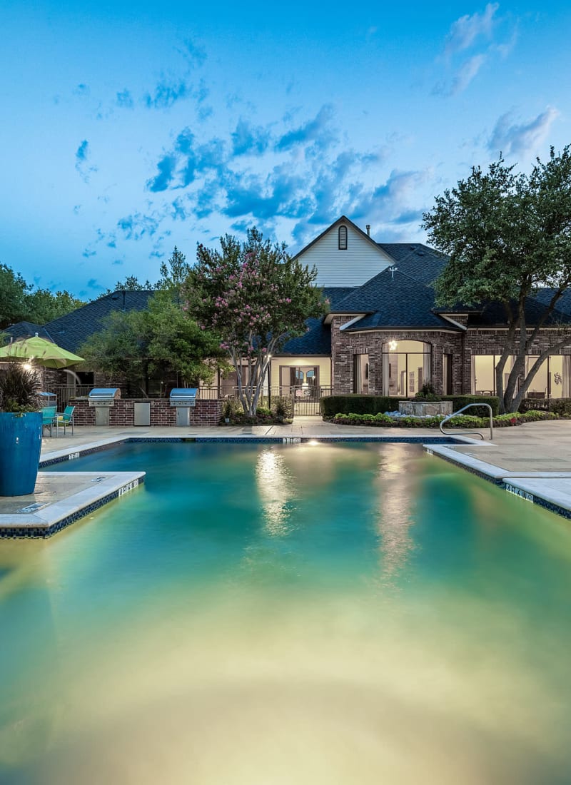 Lighted pool at sunset at Marquis at Stonebriar in Frisco, Texas