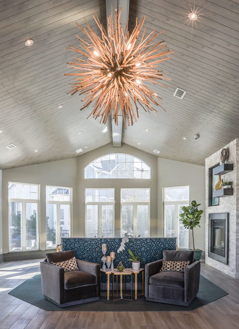 Lobby entrance with sitting area and large windows at Marquis Castle Pines in Castle Pines, Colorado