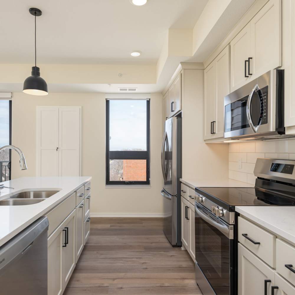 Kitchen with modern appliances at The Uptown Apartments in Waconia, Minnesota