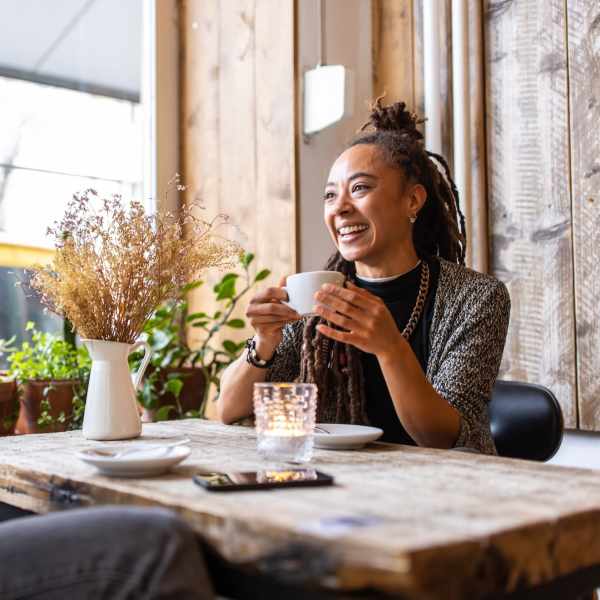 Woman having coffee near The Abbey At Northlake in Riviera Beach, Florida