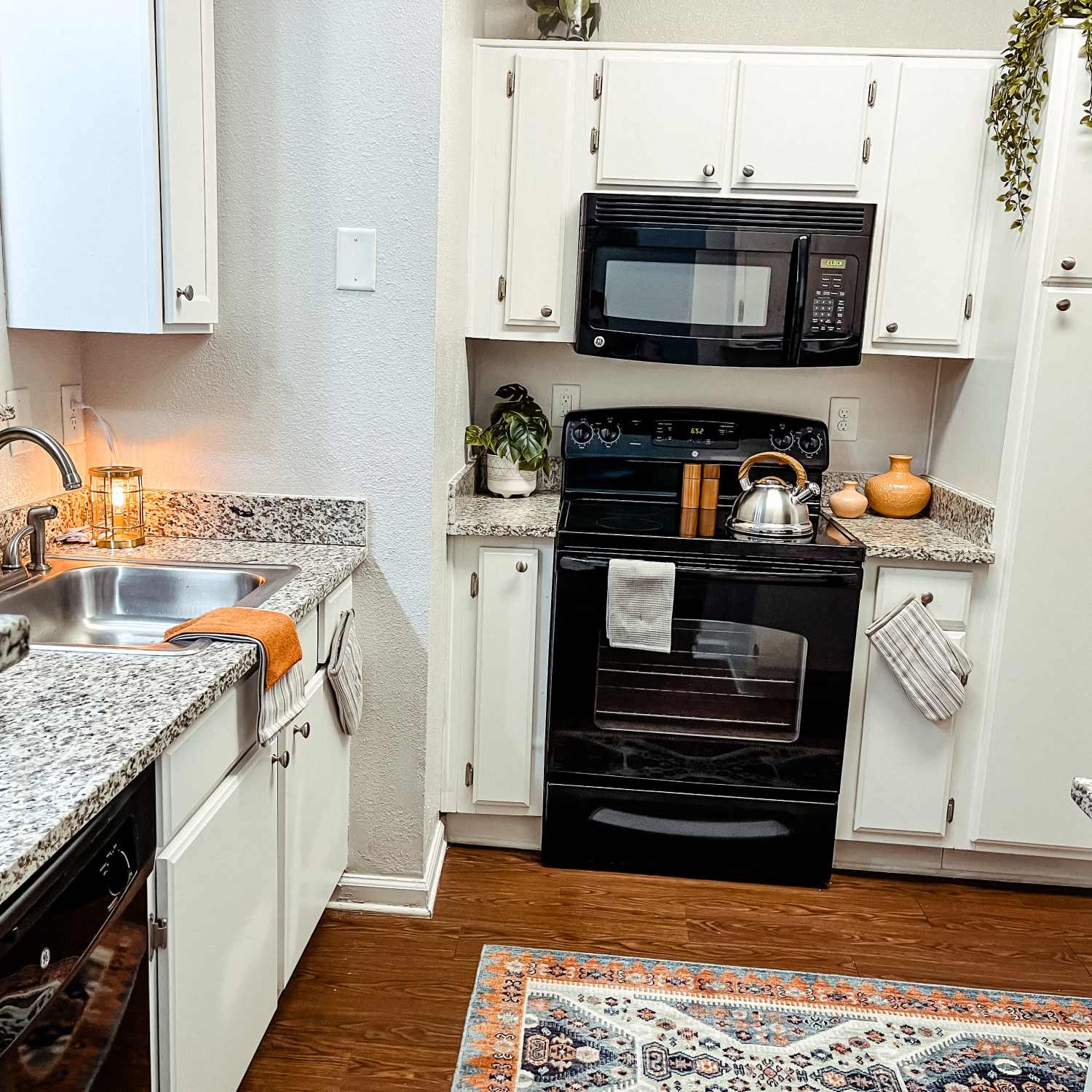 Kitchen with white cabinets at The Beacon Auburn in Auburn, Alabama