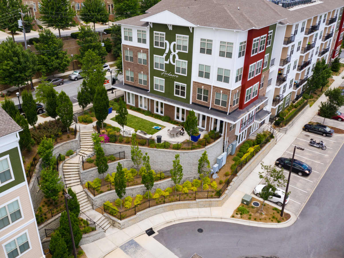 Modern stairs leading to landscaped area with seating at Ardmore & Twenty Eighth in Atlanta, Georgia