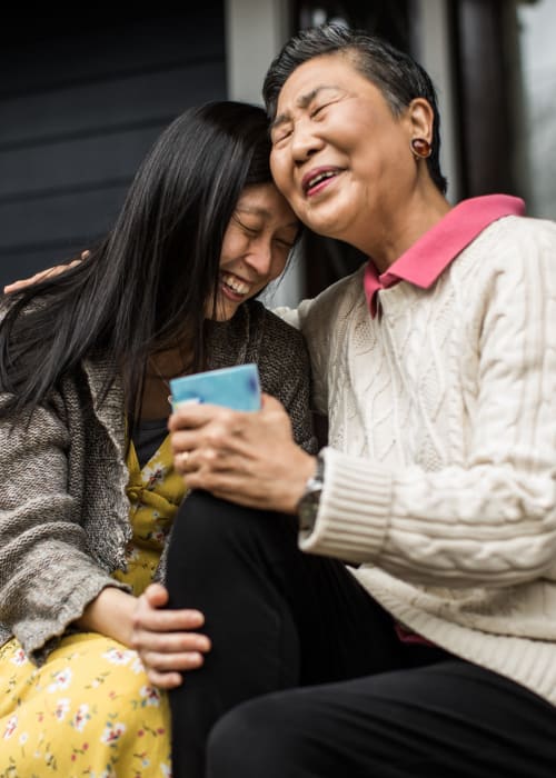 An elderly woman comforting her grandchild at The Pillars of Prospect Park in Minneapolis, Minnesota