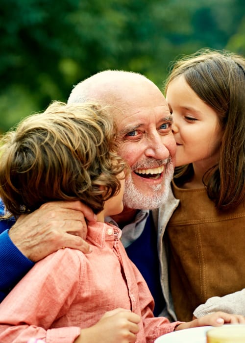 Happy grandfather with kids at Grand Villa of Deerfield Beach in Deerfield Beach, Florida