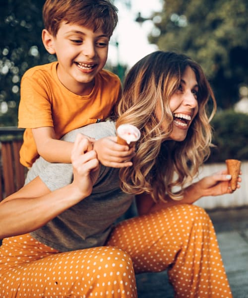 A mother and son eating ice cream near Arborgate Apartments Homes in Charlotte, North Carolina