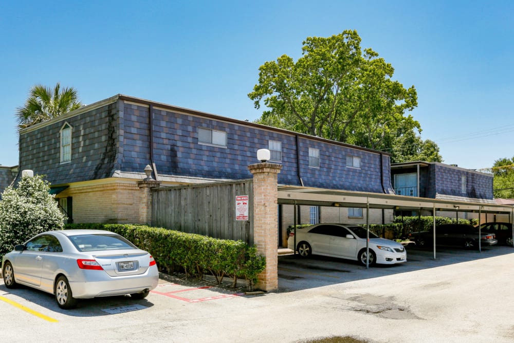 Apartment exterior and car ports at Brittany Place Apartments in Houston, Texas