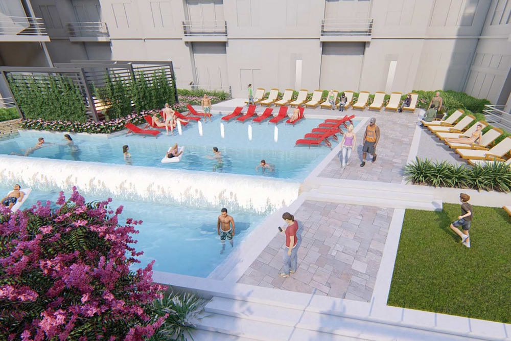 Beautiful resort-style swimming pool surrounded by chaise lounge chairs at Magnolia on the Green in Allen, Texas