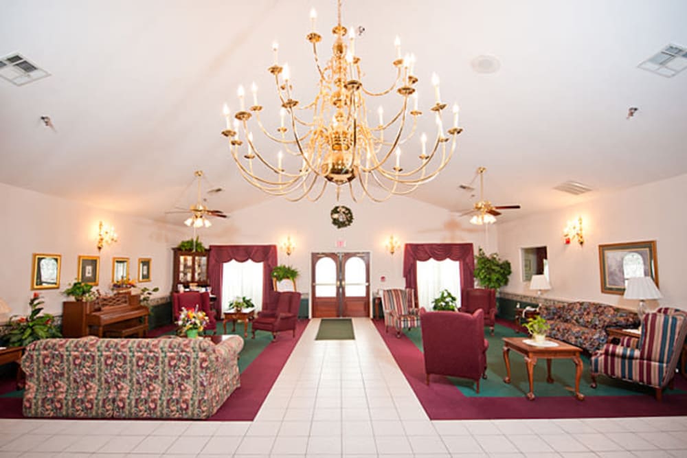 Elegant event hall with chandelier at Cambridge Square Assisted Living in Rosenberg, Texas