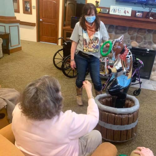 A team member interacting with a resident at Oxford Glen Memory Care at Owasso in Owasso, Oklahoma