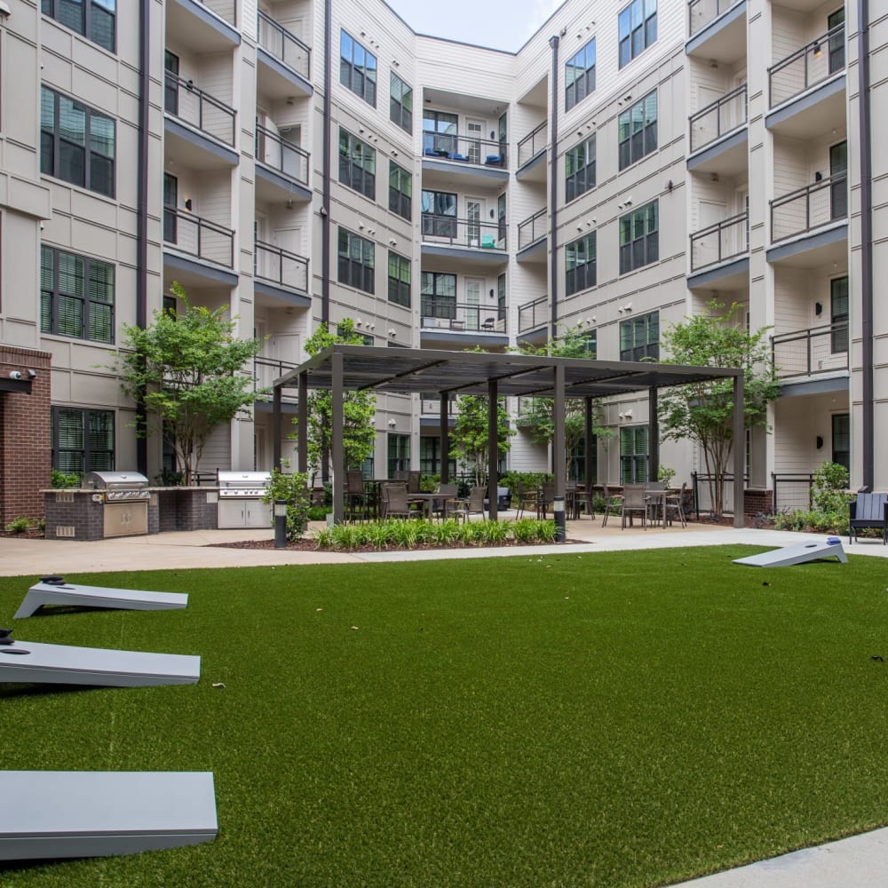 Cornhole setup on the community lawn for residents at Foundry Yards in Birmingham, Alabama