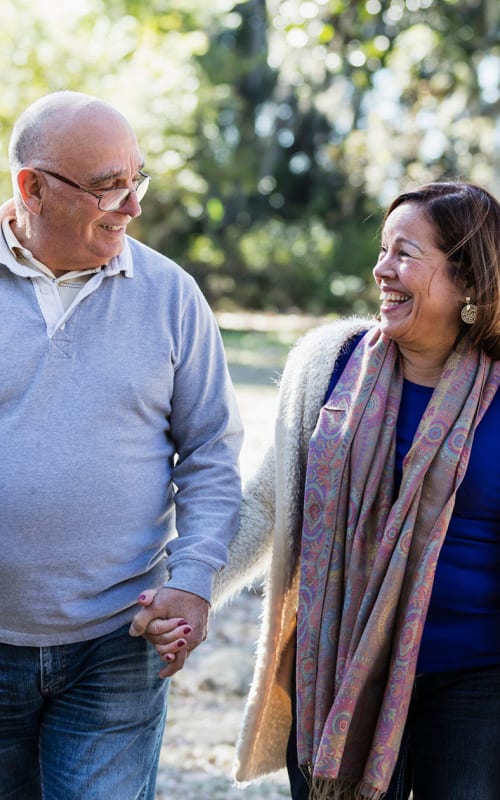 Resident couple walking outside at Regency Village at Bend in Bend, Oregon