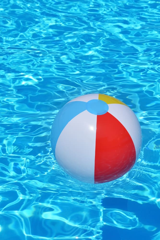 Beach ball floating in the pool at Amber Oaks in Durham, North Carolina