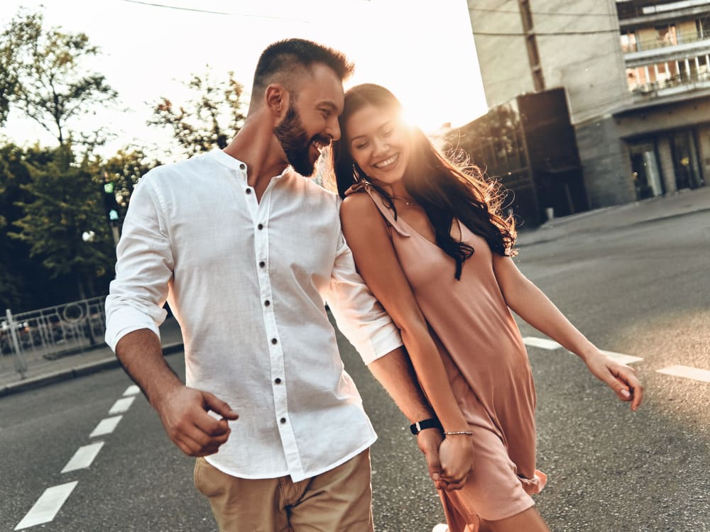 Resident couple walking downtown near Aviva in Mesa, Arizona