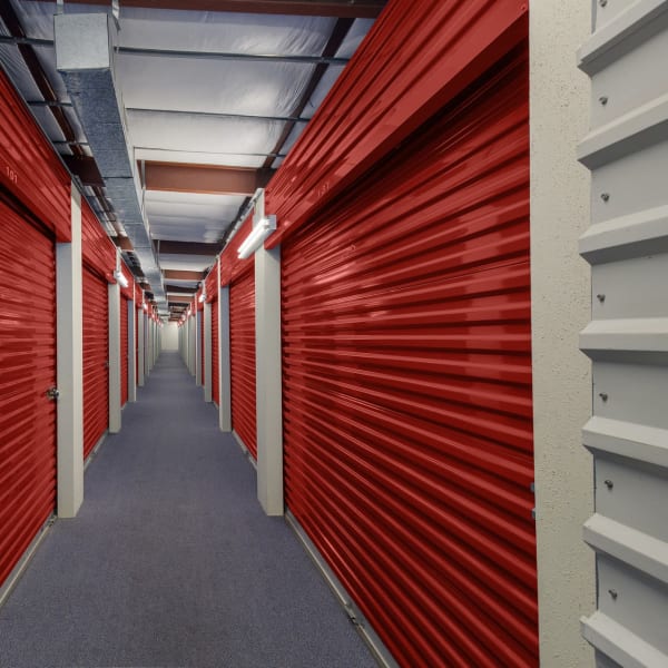 Red doors on indoor units at StorQuest Economy Self Storage in Houston, Texas