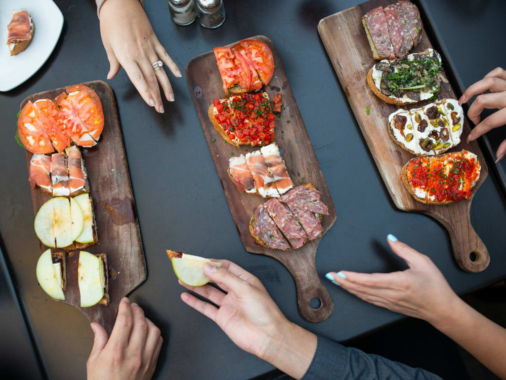 Residents enjoying appetizers near The Astor at Osborn in Phoenix, Arizona