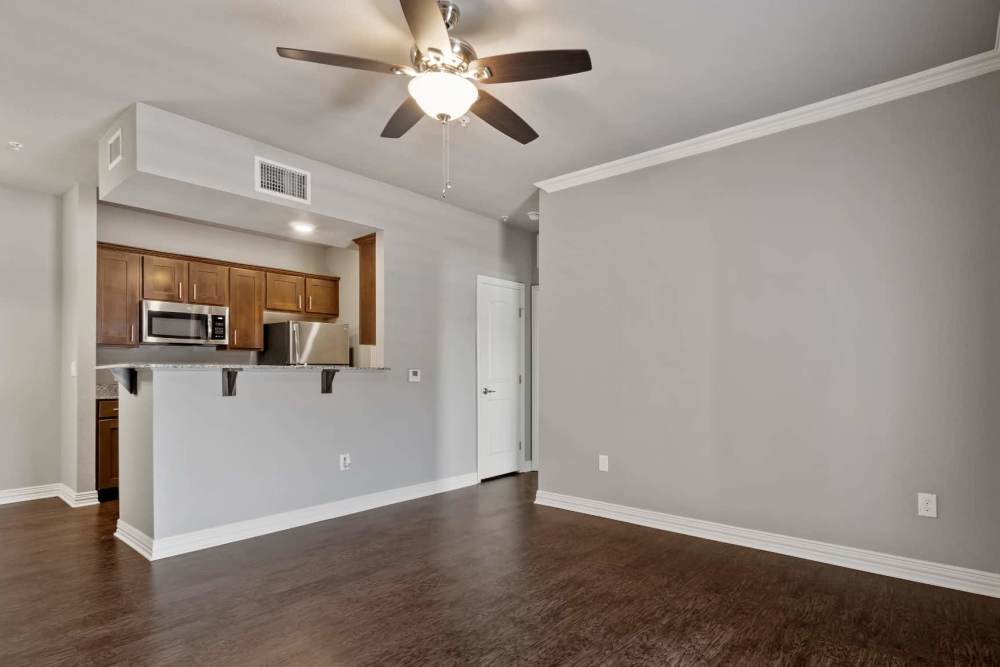 Open kitchen with wood flooring at Pine Creek in Paris, Texas