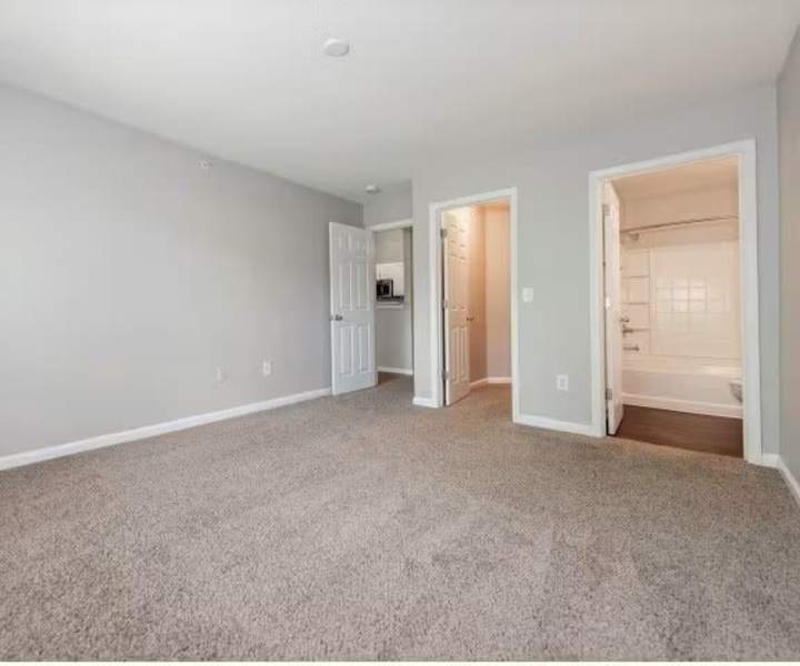 Spacious bed room at Arbors at Fairview Apartments in Simpsonville, South Carolina