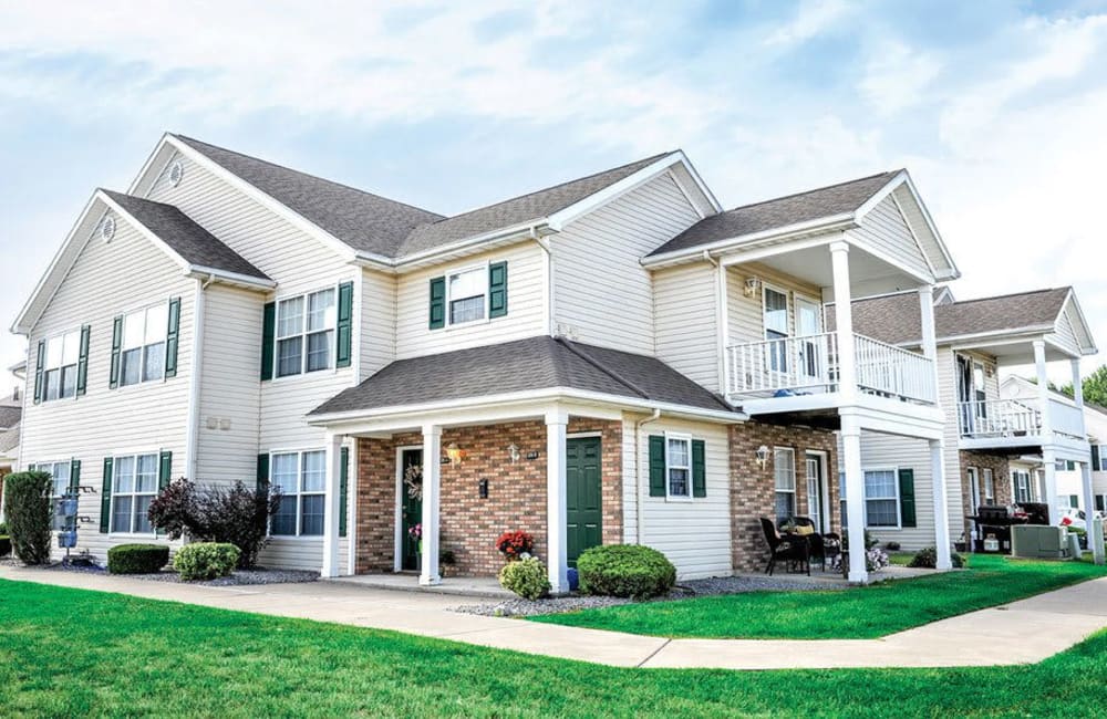 Building exterior with private patios and balconies at Westview Commons Apartments in Rochester, New York