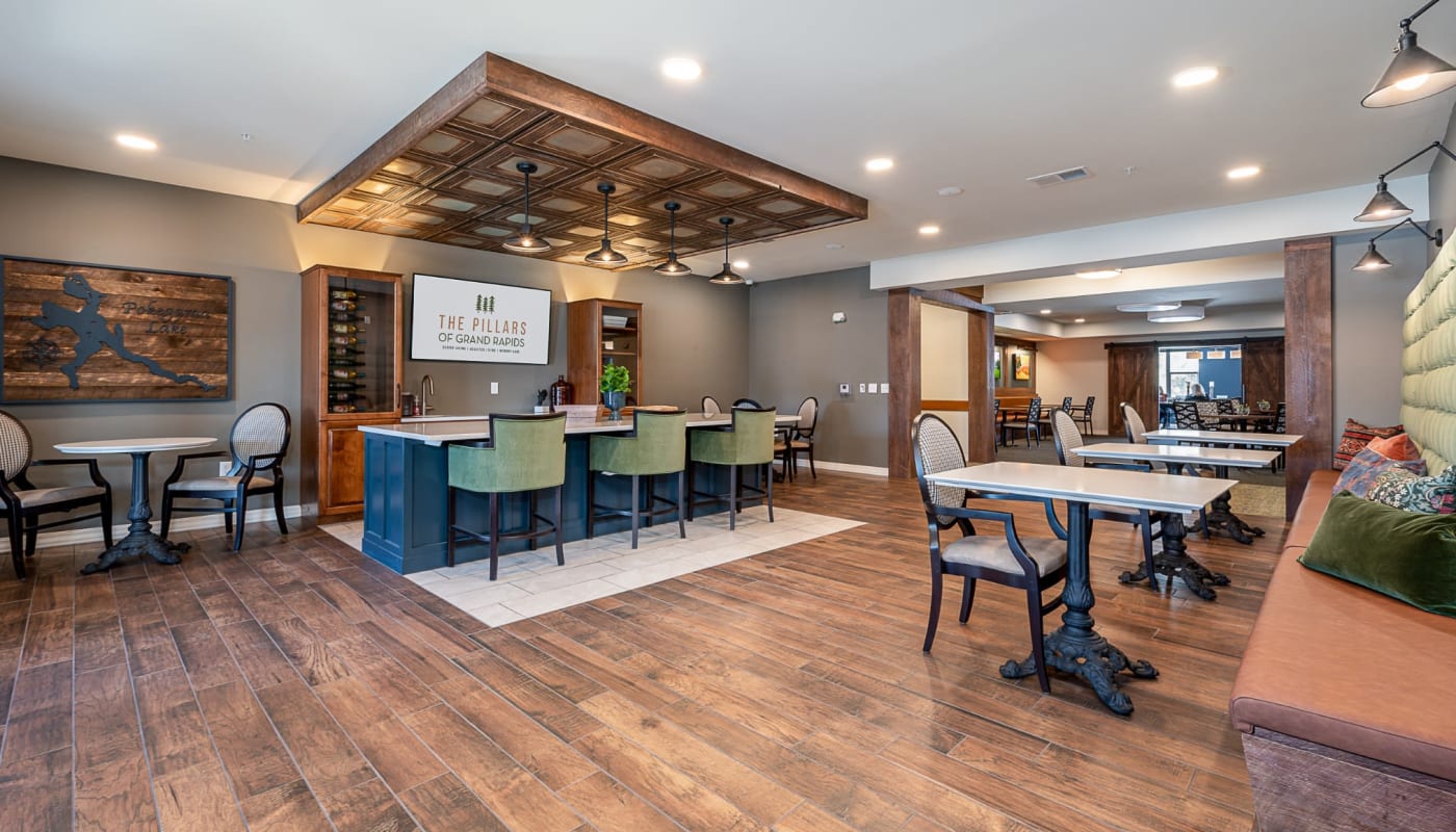 Community bar area with booths and counter seating at The Pillars of Grand Rapids in Grand Rapids, Minnesota