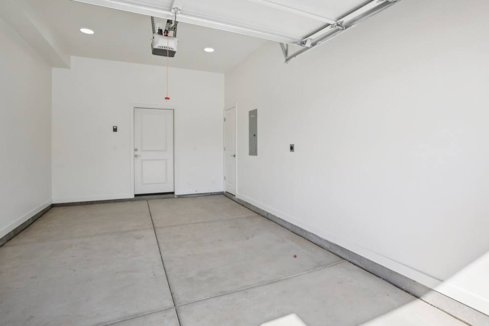 A white room with a door and a window.