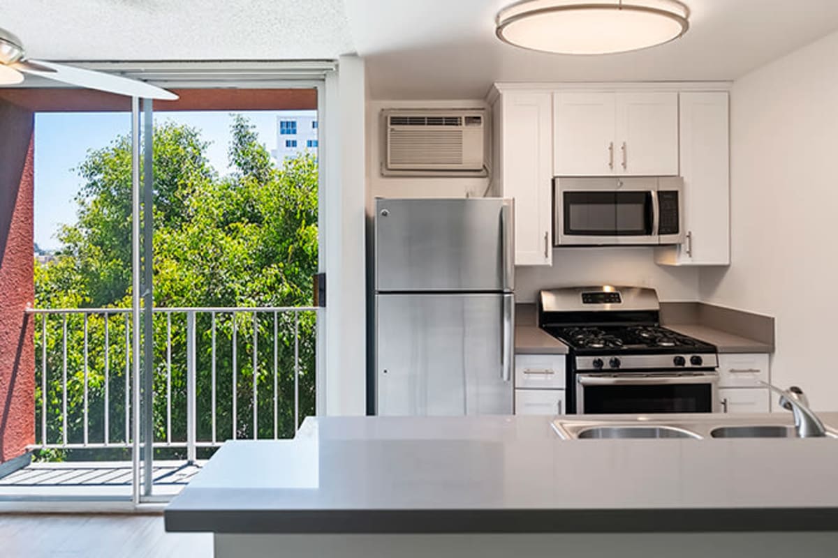 Apartment with modern kitchen and private balcony at The Ruby Hollywood, Los Angeles, California