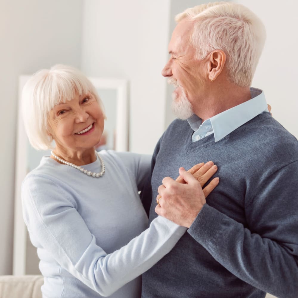 A senior couple dancing together at North American Senior Living in Medford, Oregon