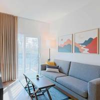 Modern living room with balcony access at WaterWalk Jacksonville - Deerwood Park in Jacksonville, Florida