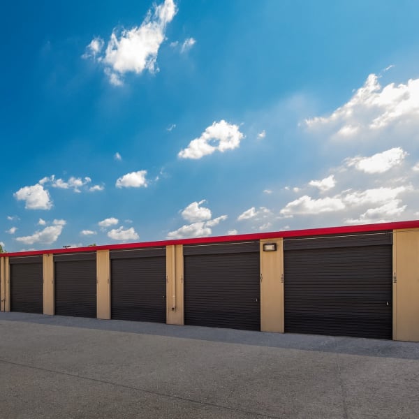 Outdoor drive-up storage units at StorQuest Economy Self Storage in Tomball, Texas