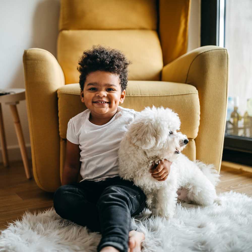 A boy with his pet dog at Stadium West Apartments in Arlington,Texas