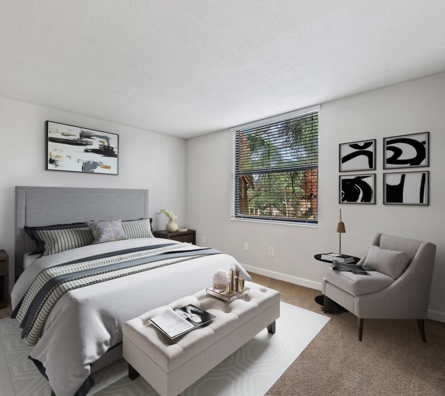 Model bedroom with plush carpeting of Bull Run Apartments in Miami Lakes, Florida