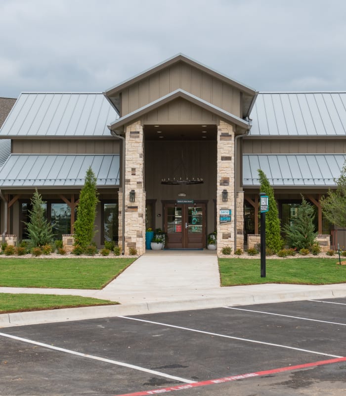 Front entrance to Bend at New Road Apartments in Waco, Texas