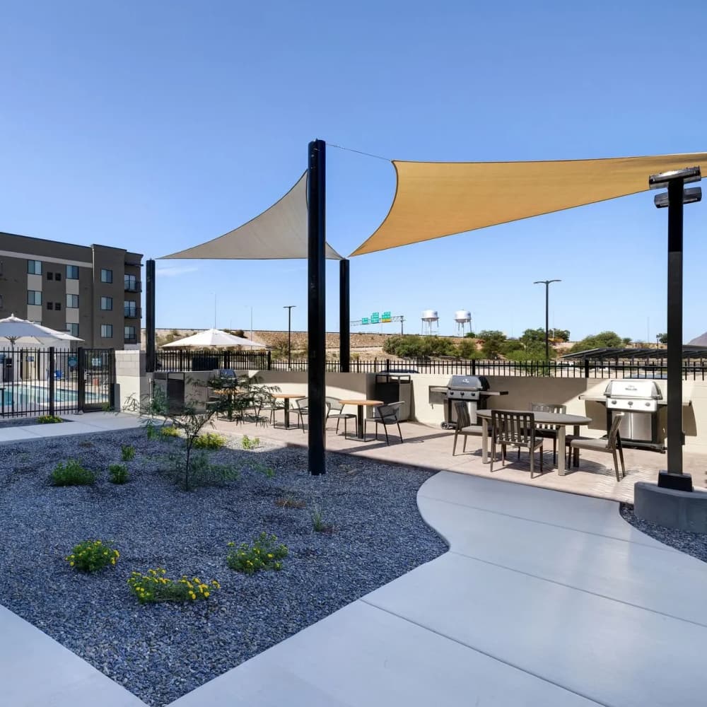 Resort-style pool area with shaded seating at WaterWalk Huntsville in Huntsville, Alabama