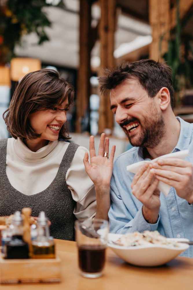Resident couple enjoying their food at a restaurant near Tucasa Townhomes in Irving, Texas