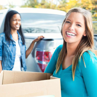 resident unpacking her boxes at Forster Hills in Oceanside, California