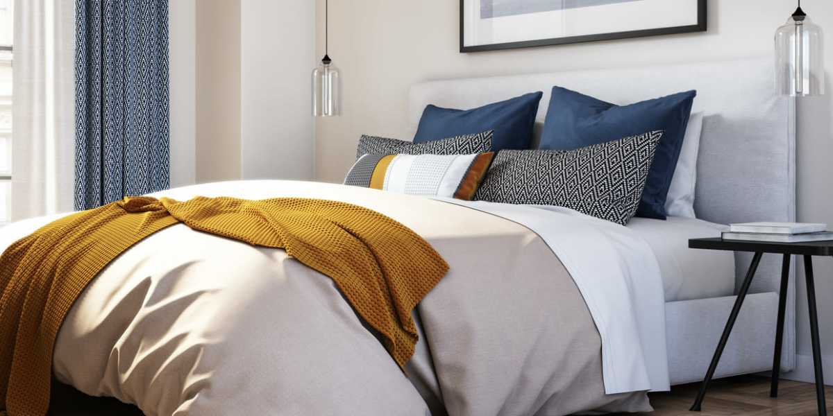 A modern, furnished bedroom at Capitol Green Apartments in Albany, New York
