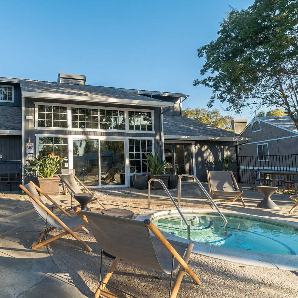 Swimming pool with lounge setup at Bay Village in Vallejo, California