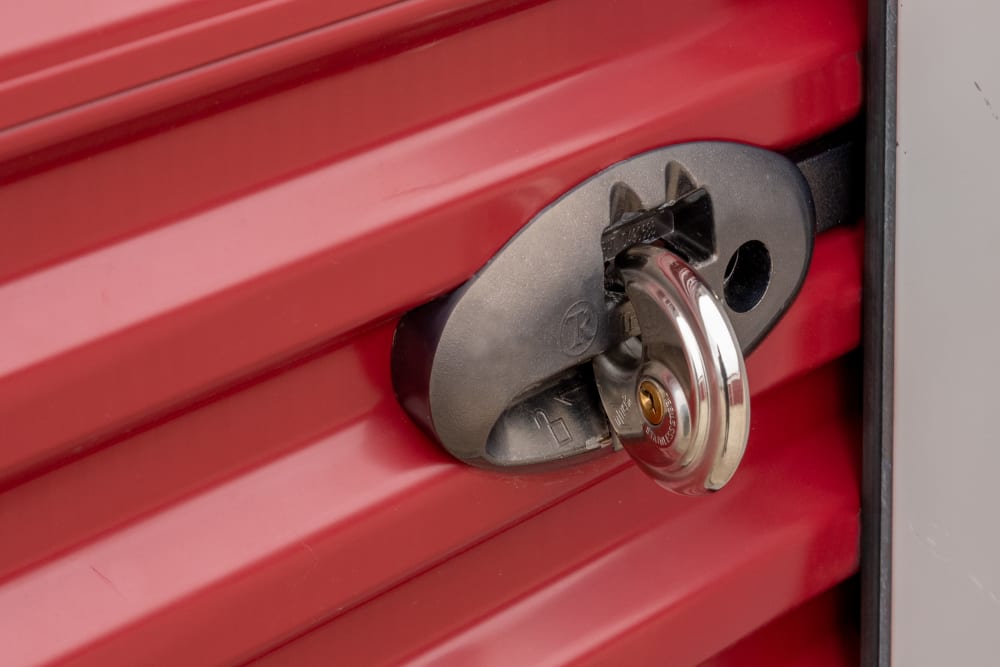 A lock on a red storage unit door at StayLock Storage in Hurricane, West Virginia