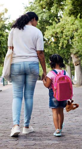 Resident taking her kid to school near Panorama at Arvada Ridge in Arvada,Colorado