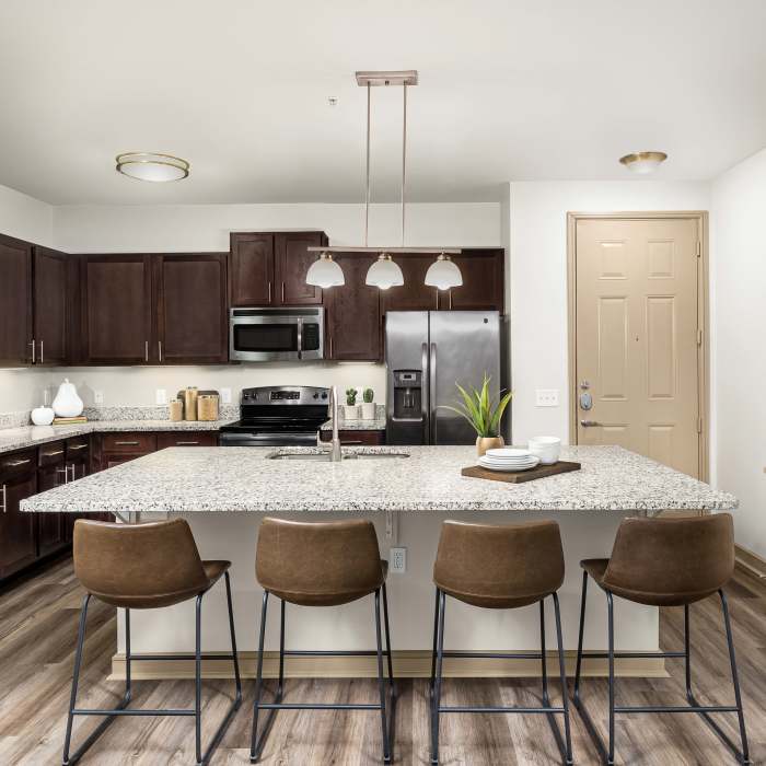 Kitchen with island at Estates of Richardson
