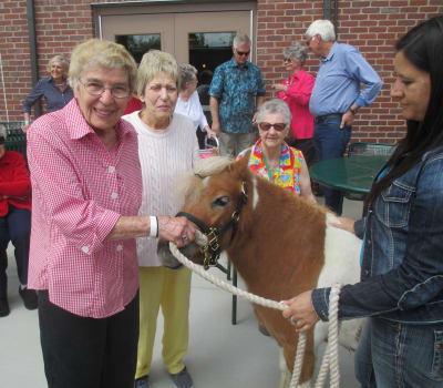 Happy seniors enjoying activities at Eastern Star Masonic Retirement Campus in Denver, CO