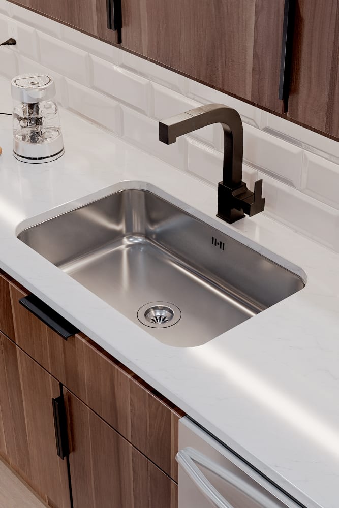 Stainless steel kitchen sink at Solana Stapleton Apartments in Denver, Colorado